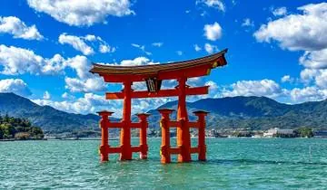 A parent planning a family trip to Japan while sitting in a cozy cafe.